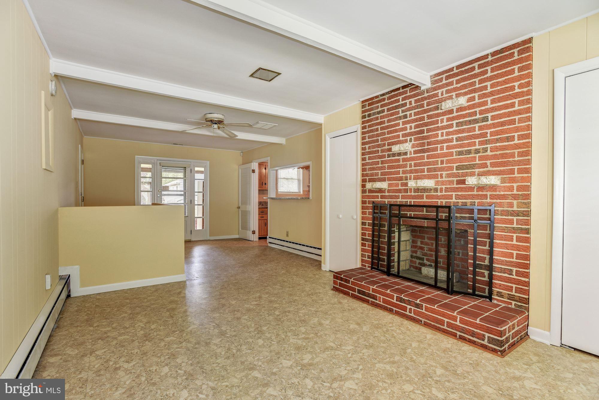 8492 Laurel Road Pasadena, MD 21122 - Photo 14 of 46 an empty room with windows