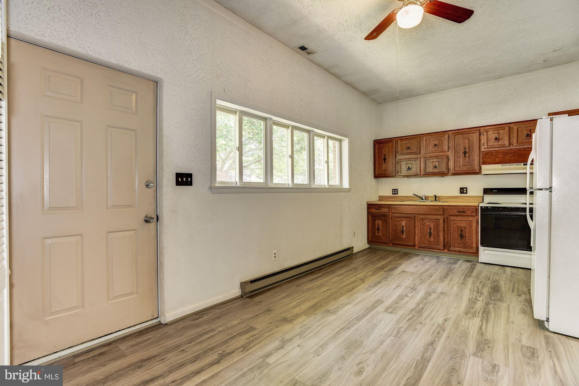 8492 Laurel Road Pasadena, MD 21122 - Photo 24 of 46 a view of kitchen with wooden floor