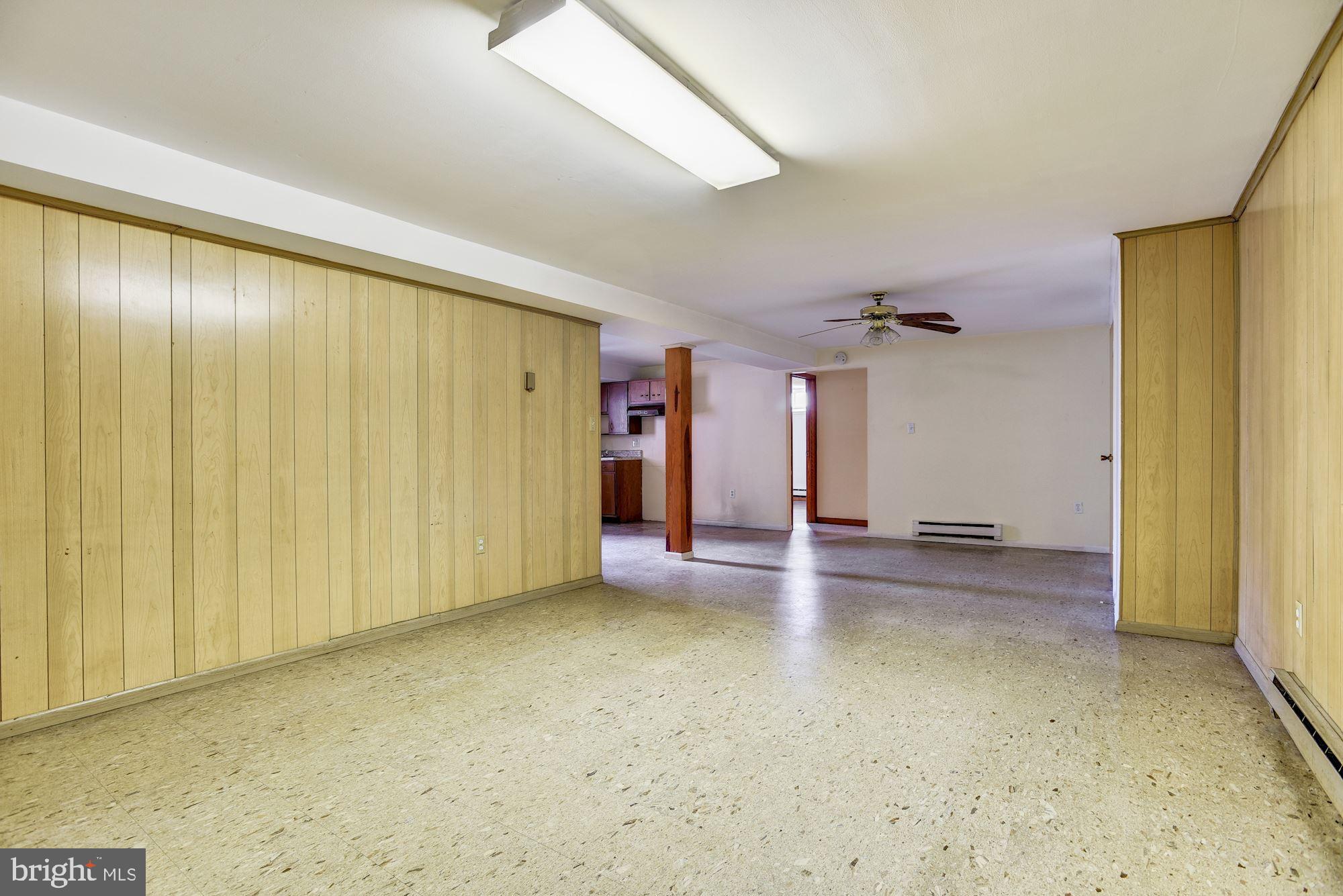 8492 Laurel Road Pasadena, MD 21122 - Photo 31 of 46 a view of a livingroom with a staircase