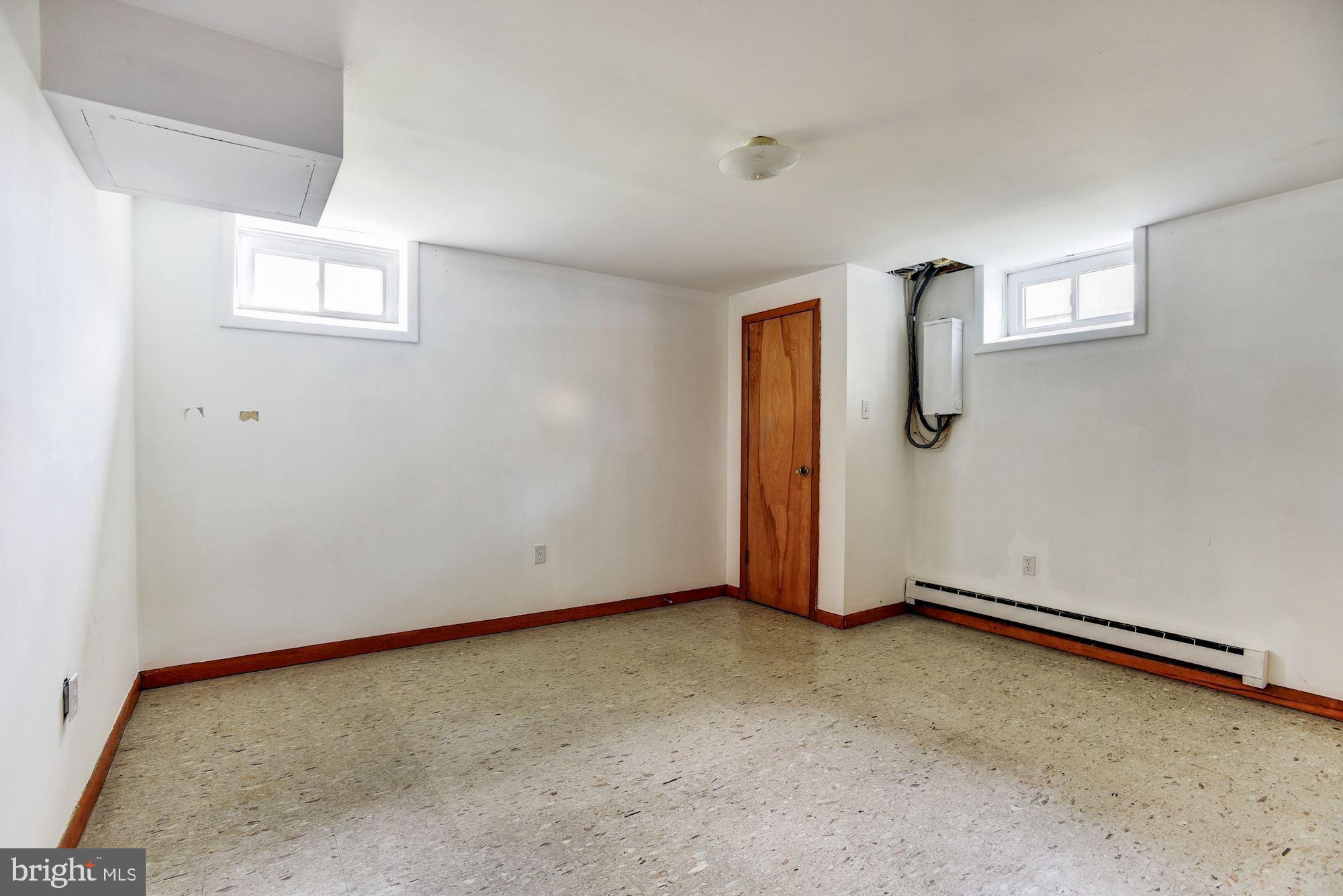 8492 Laurel Road Pasadena, MD 21122 - Photo 36 of 46 an empty room with windows