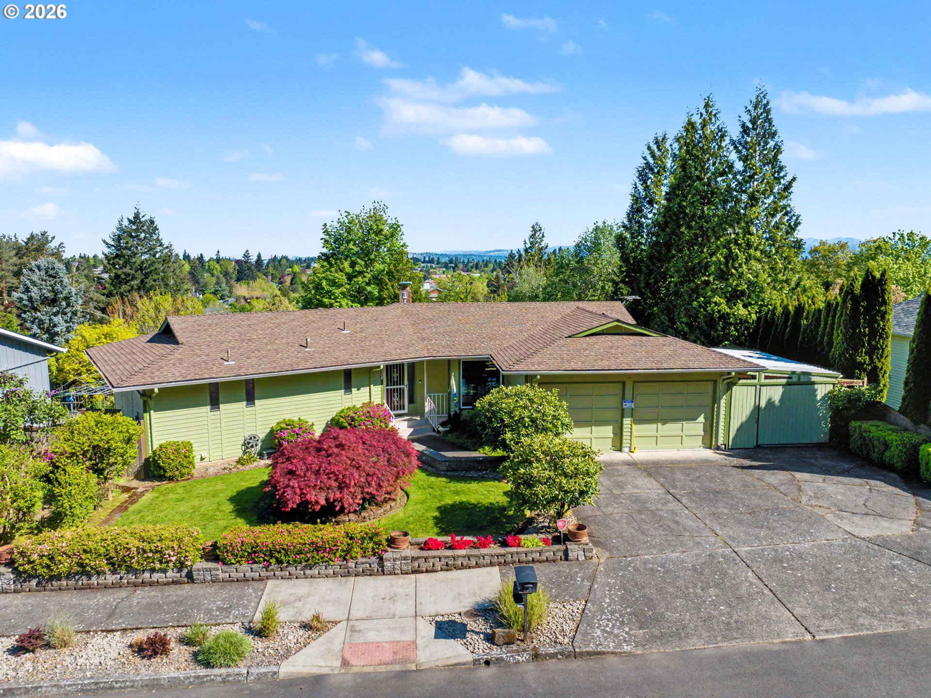 407 Southwest 7th Street Gresham, OR 97080 - Photo 1 of 48 a view of a patio with table and chairs under an umbrella