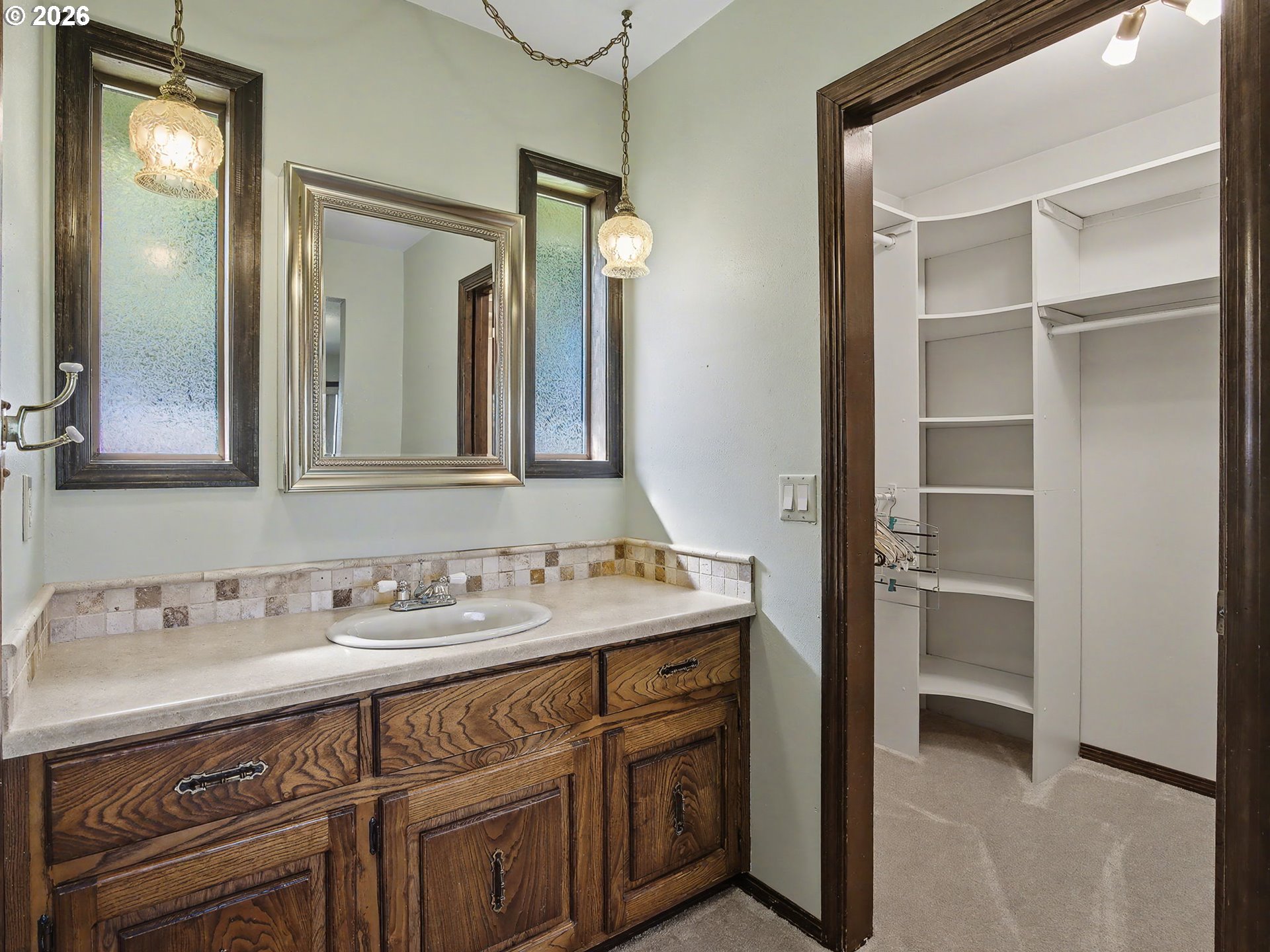 407 Southwest 7th Street Gresham, OR 97080 - Photo 16 of 48 a bathroom with a sink and a mirror