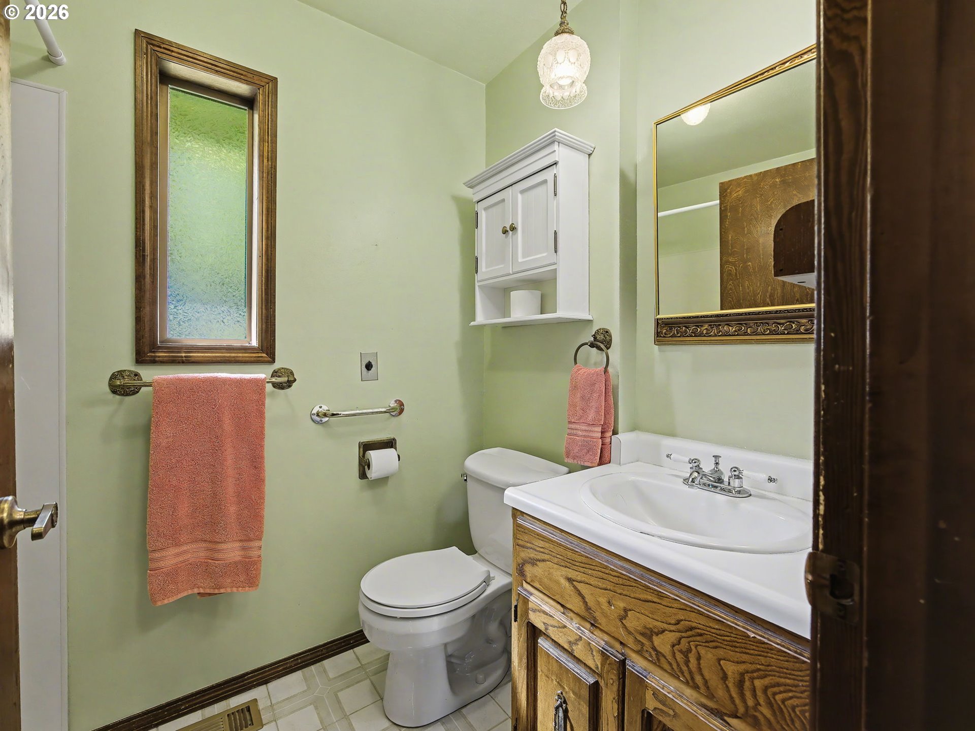 407 Southwest 7th Street Gresham, OR 97080 - Photo 19 of 48 a bathroom with a sink a toilet and mirror