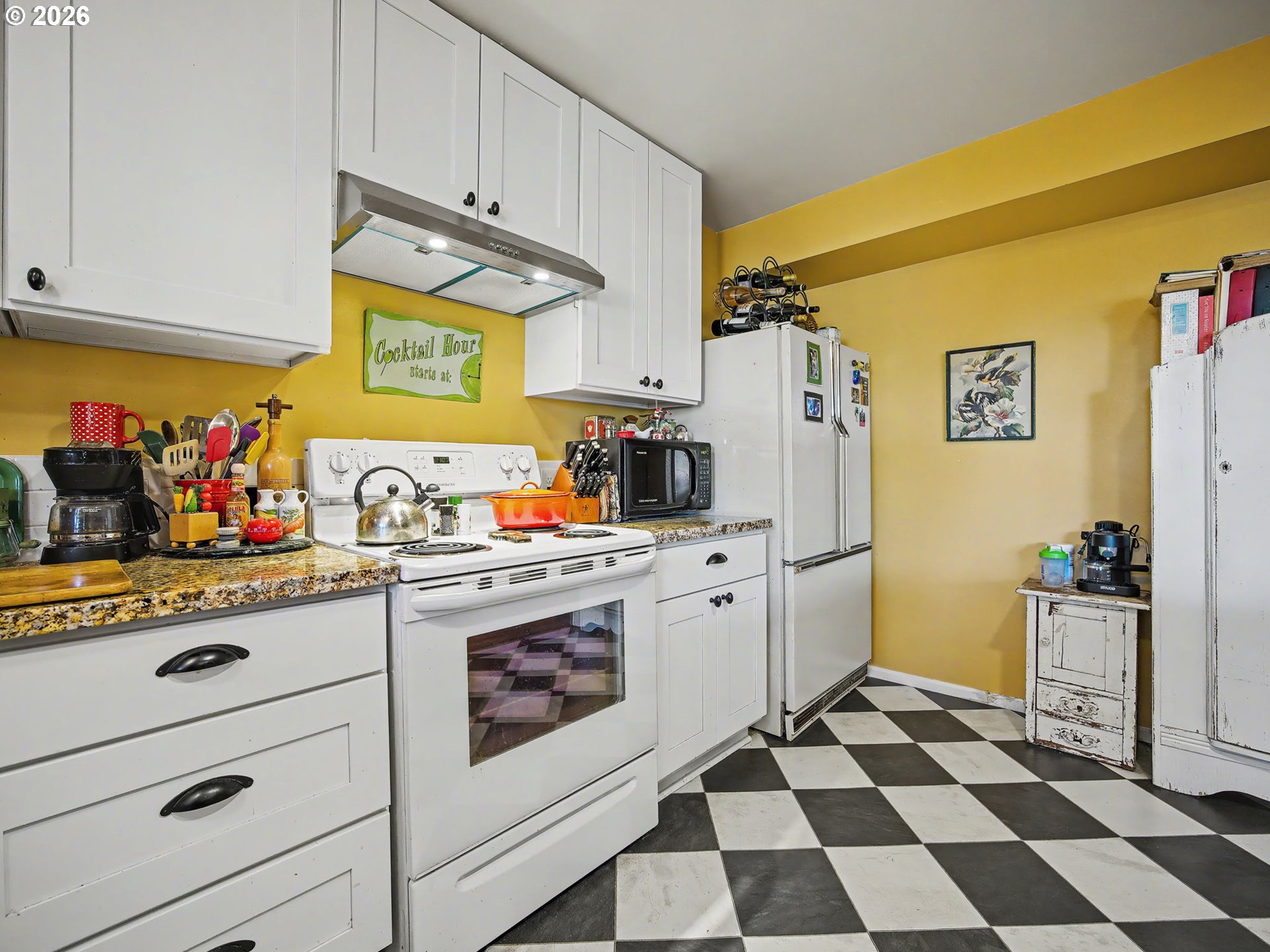 407 Southwest 7th Street Gresham, OR 97080 - Photo 24 of 48 a kitchen with a refrigerator and cabinets