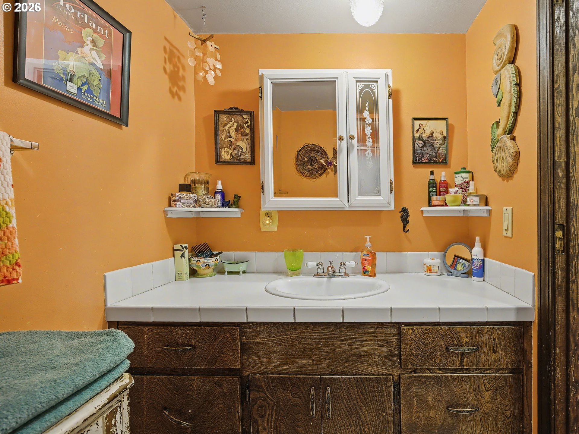 407 Southwest 7th Street Gresham, OR 97080 - Photo 27 of 48 a bathroom with a sink and a mirror