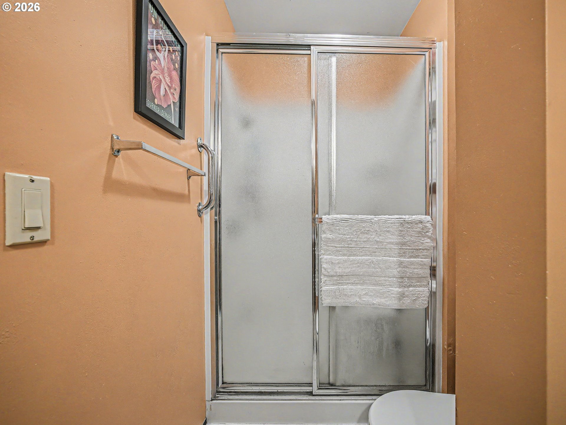 407 Southwest 7th Street Gresham, OR 97080 - Photo 28 of 48 a bathroom with a glass shower door