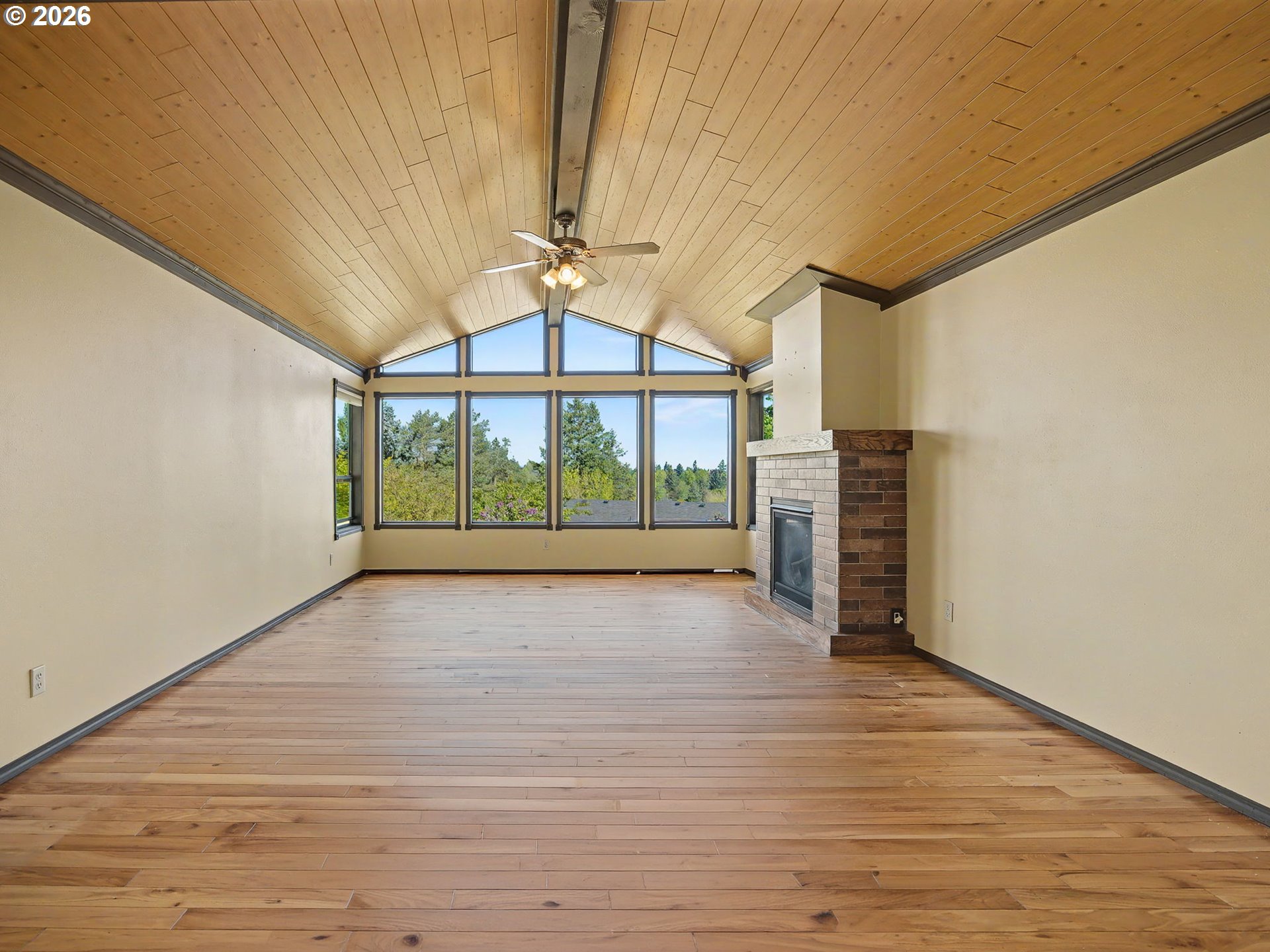 407 Southwest 7th Street Gresham, OR 97080 - Photo 3 of 48 a view of empty room with wooden floor and fan