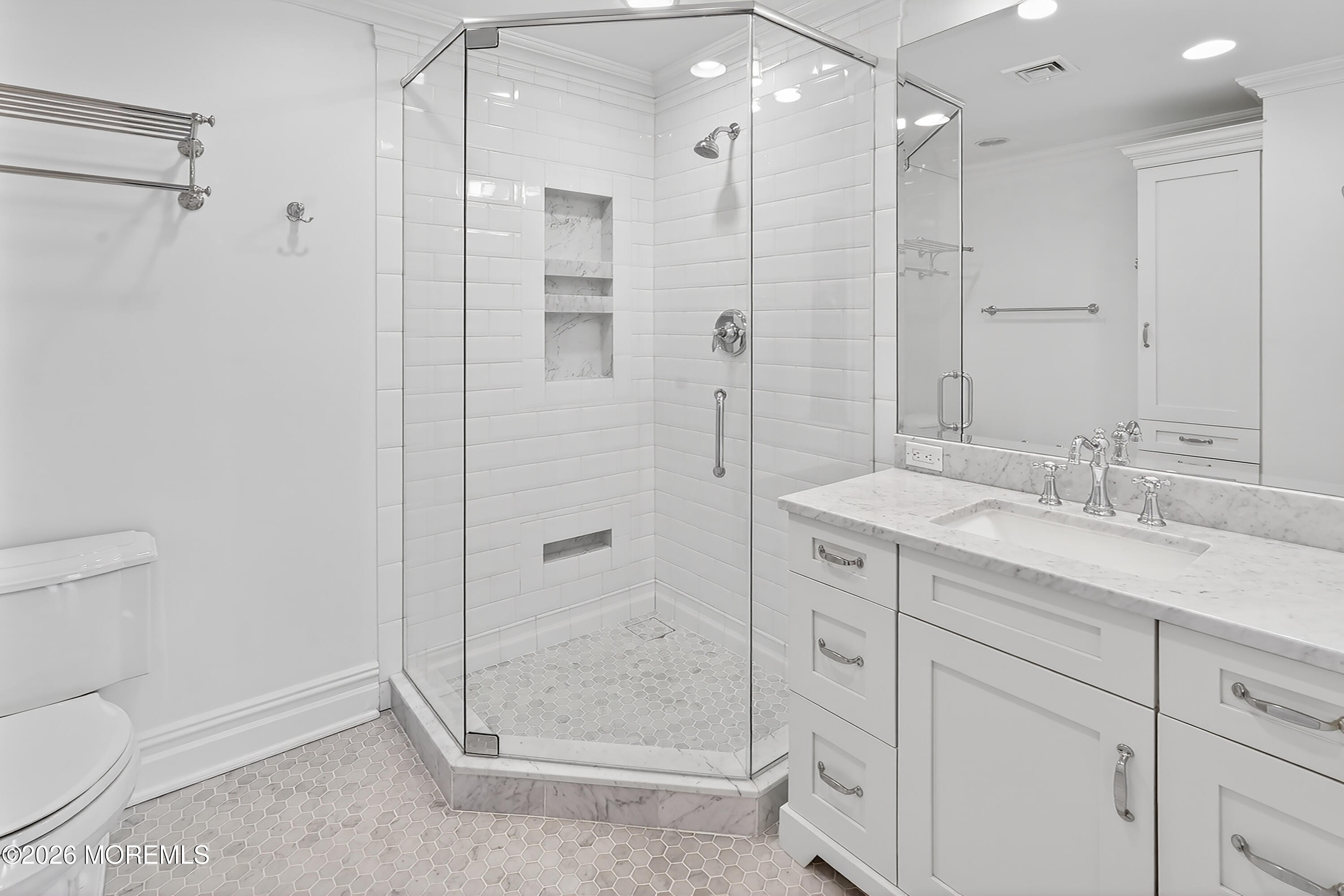 65 East River Road, Unit 20 Rumson, NJ 07760 - Photo 11 of 31 a bathroom with a shower sink vanity and mirror