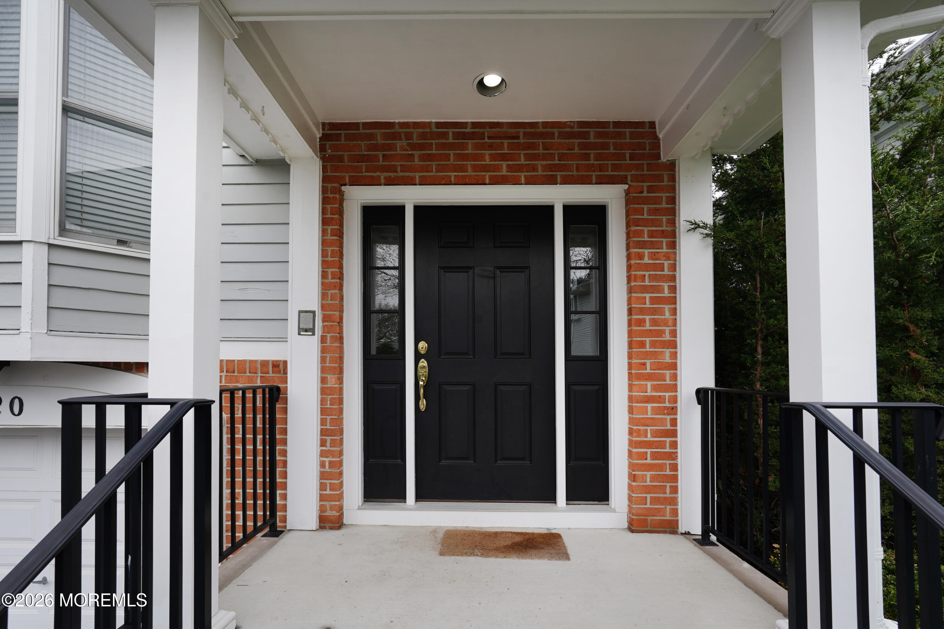 65 East River Road, Unit 20 Rumson, NJ 07760 - Photo 2 of 31 a front view of a house with balcony