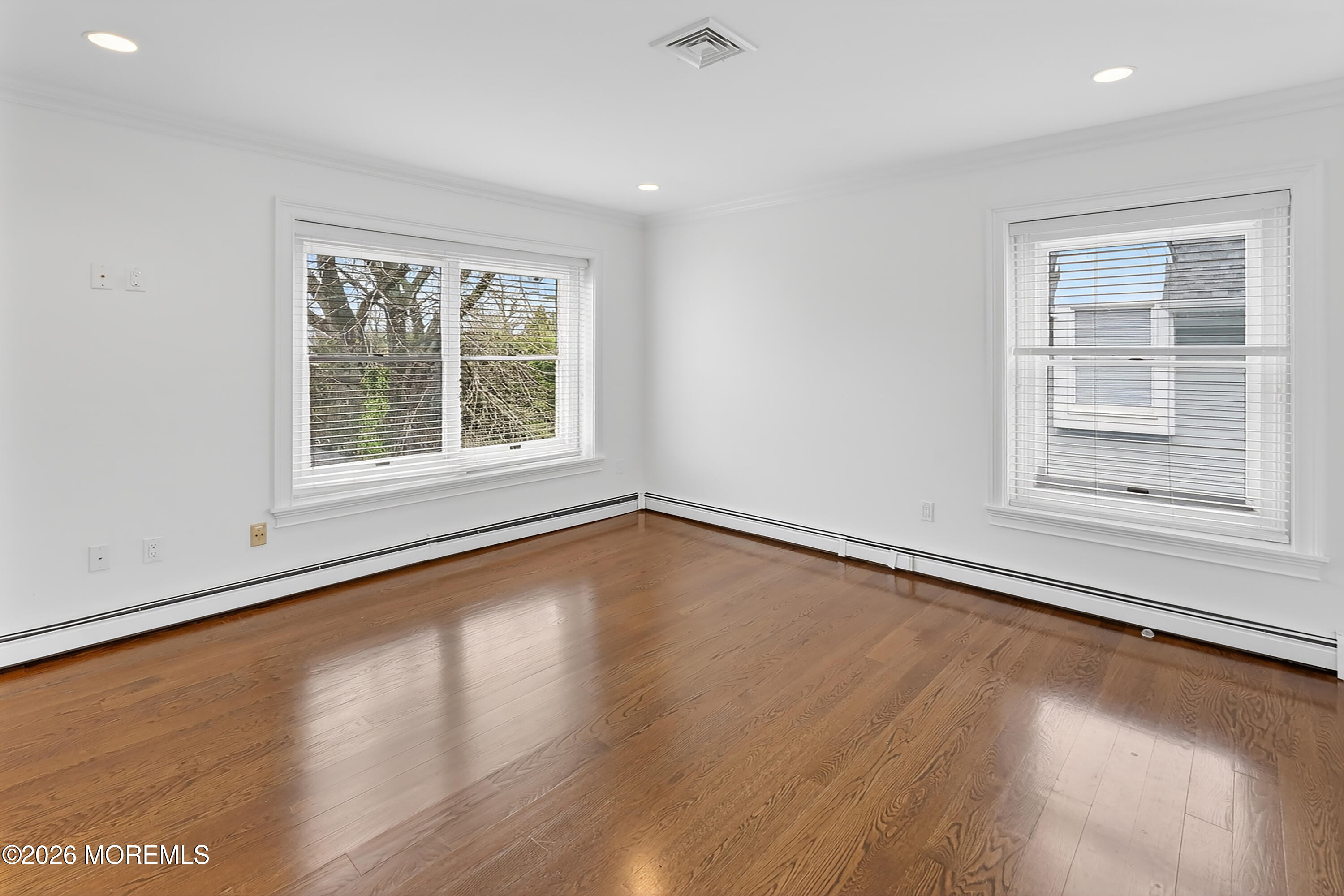 65 East River Road, Unit 20 Rumson, NJ 07760 - Photo 31 of 31 an empty room with wooden floor and windows