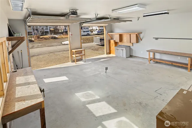 a view of a big room with windows and cabinet