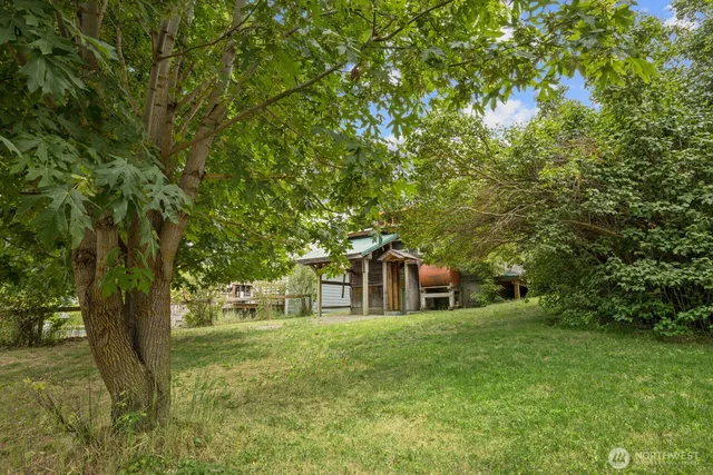 an aerial view of multiple houses with yard