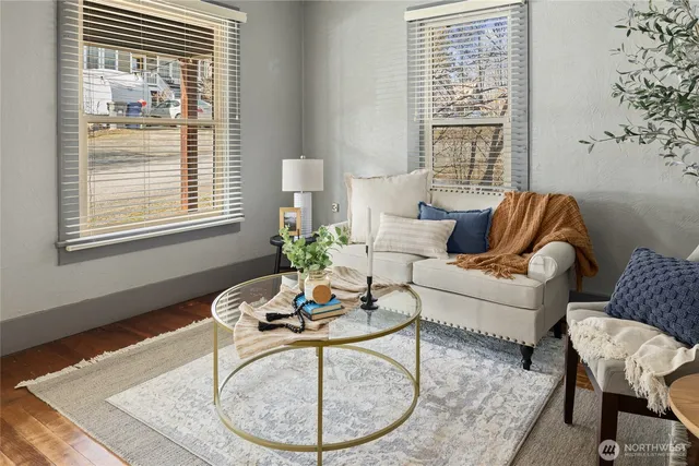a living room with furniture and a potted plant