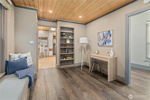 a livingroom with furniture and a fireplace