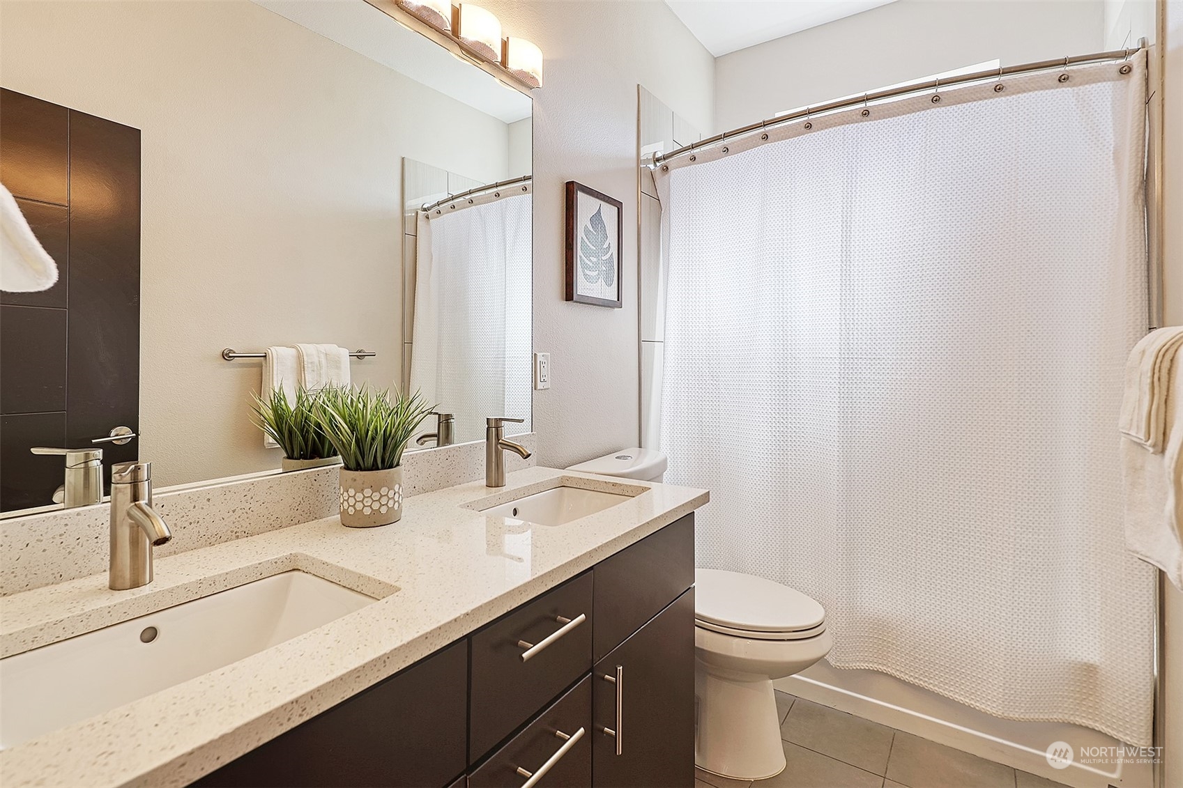 3263 35th Avenue Southwest Seattle, WA 98126 - Photo 23 of 38 a bathroom with a sink a toilet and a mirror