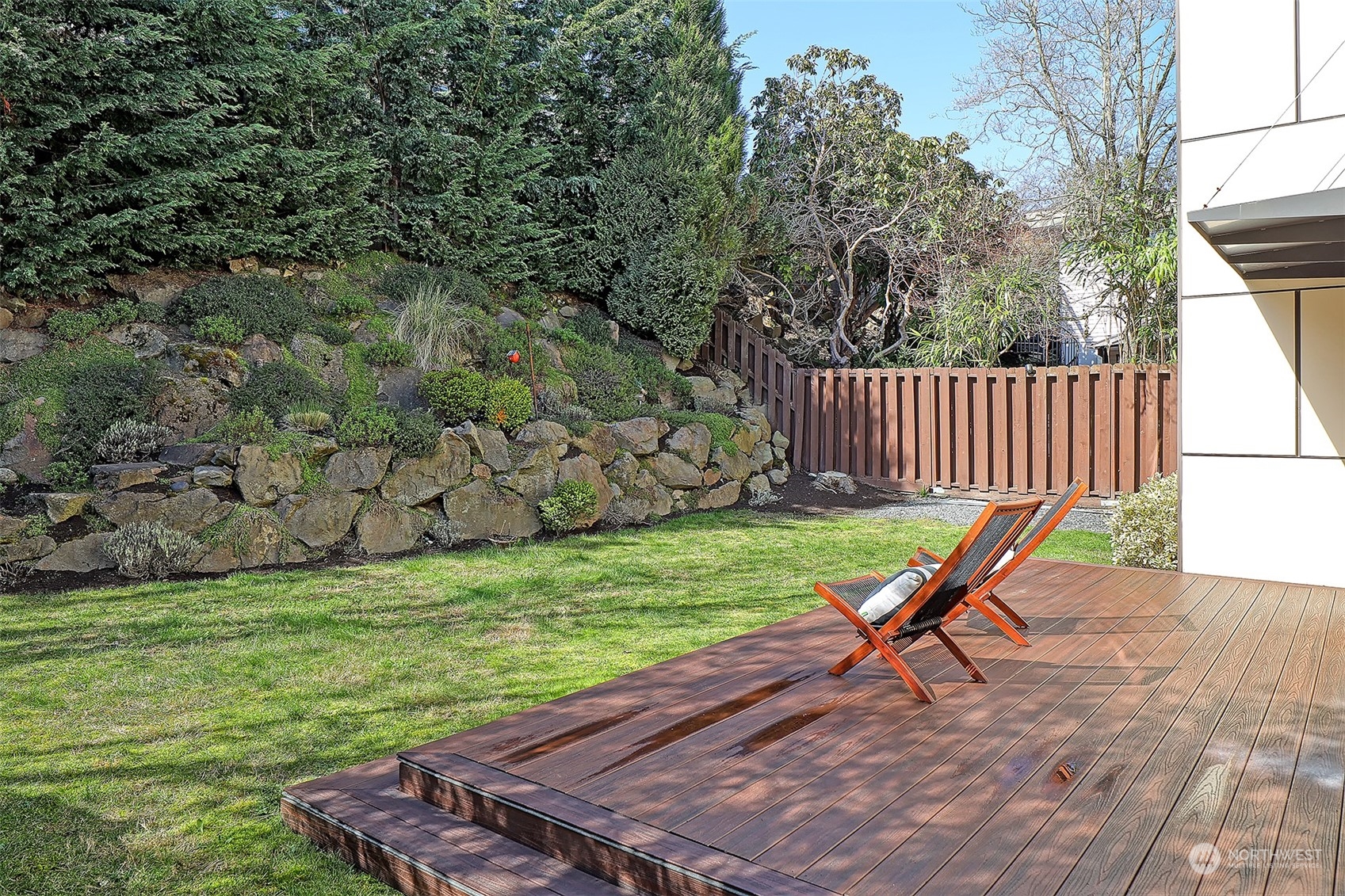 3263 35th Avenue Southwest Seattle, WA 98126 - Photo 31 of 38 a view of a wooden chairs in backyard of the house