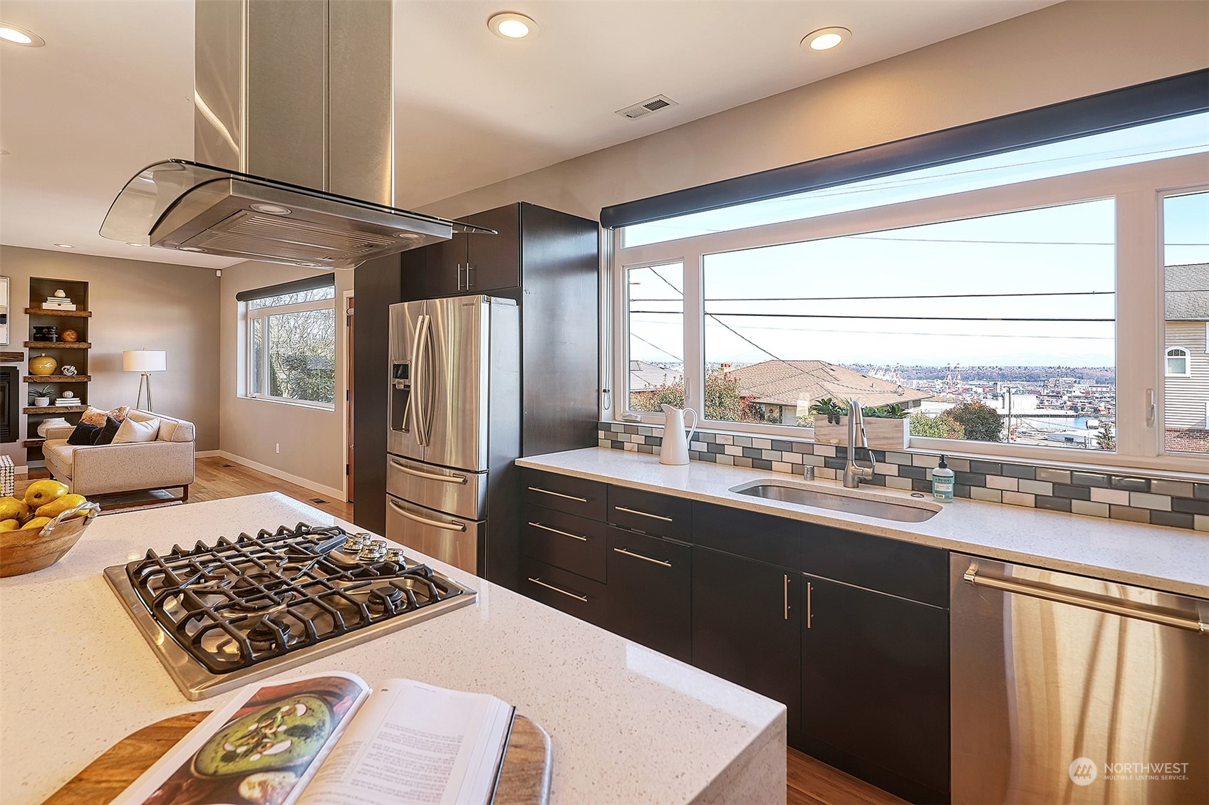 3263 35th Avenue Southwest Seattle, WA 98126 - Photo 8 of 38 a kitchen with stainless steel appliances granite countertop a sink stove and refrigerator