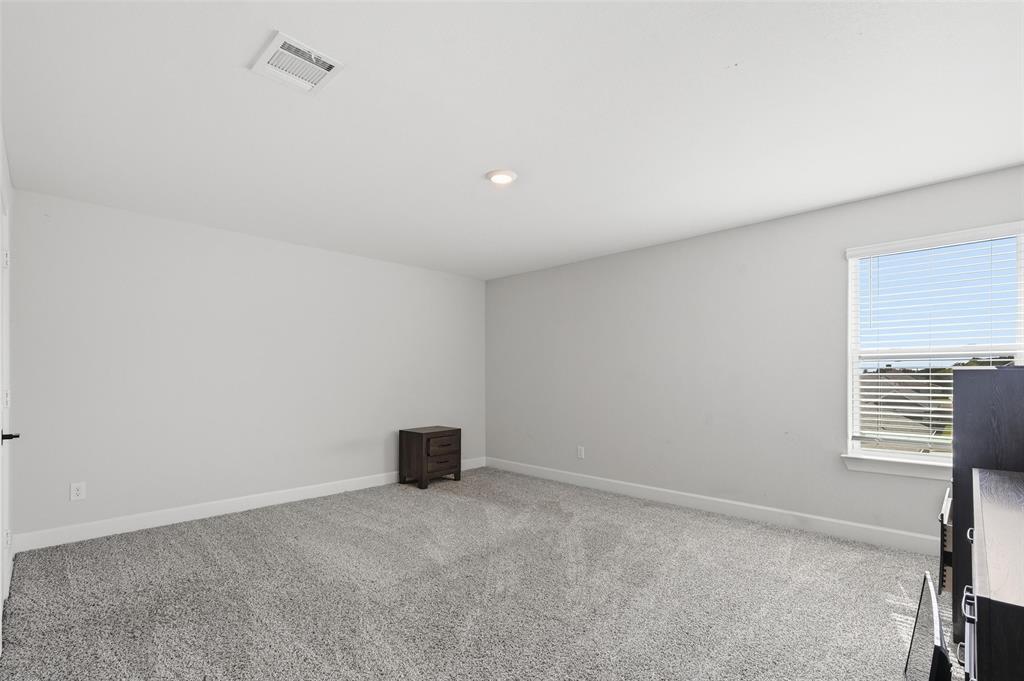 7612 Duck Bay Road Fort Worth, TX 76120 - Photo 15 of 32 a view of an empty room and a window