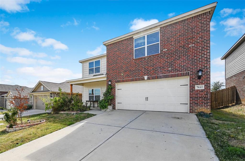 7612 Duck Bay Road Fort Worth, TX 76120 - Photo 2 of 32 a view of a house with a yard