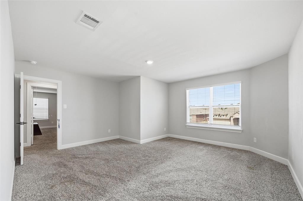 7612 Duck Bay Road Fort Worth, TX 76120 - Photo 23 of 32 a view of an empty room with a window