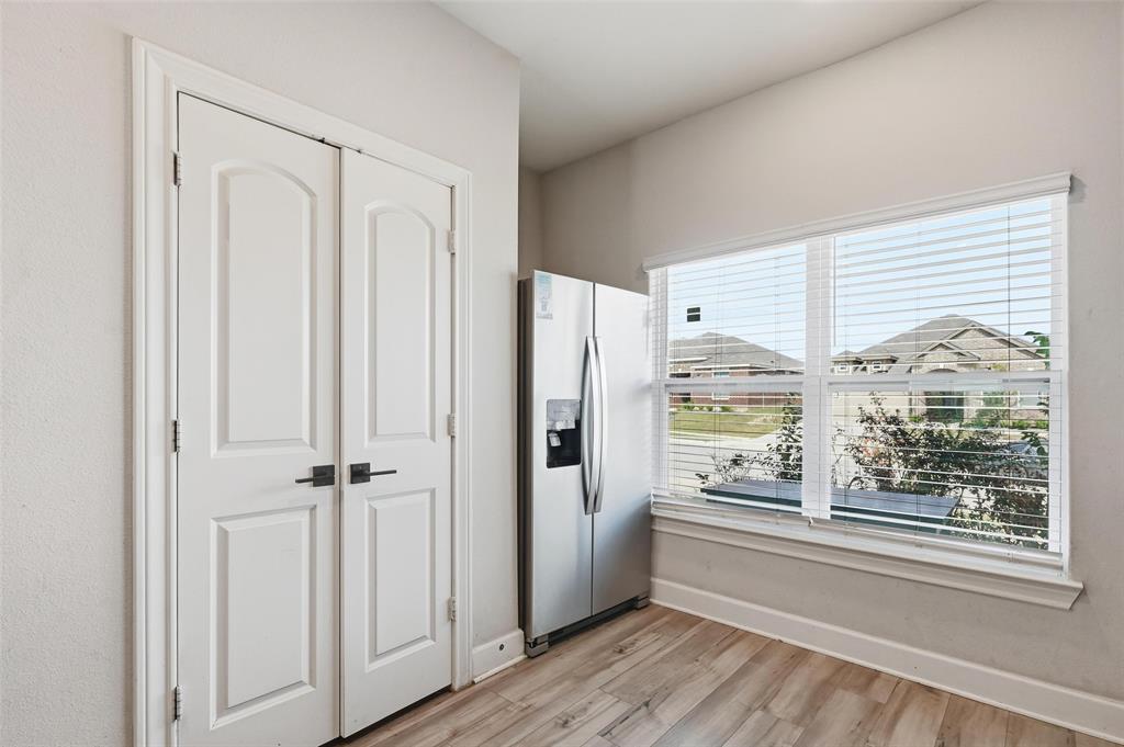 7612 Duck Bay Road Fort Worth, TX 76120 - Photo 5 of 32 a view of a kitchen with closet and windows