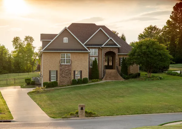 a front view of a house with a yard