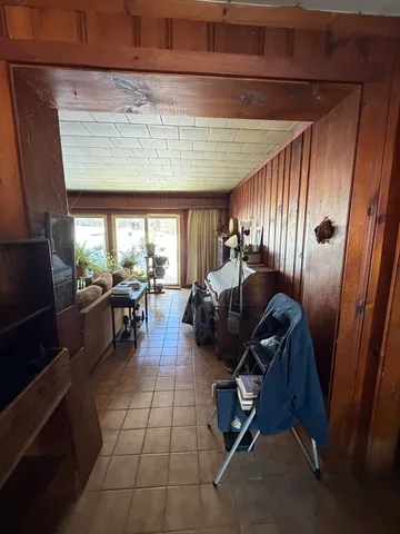 a room with lots of chairs and mirrors