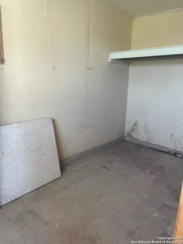 a kitchen with cabinets and window