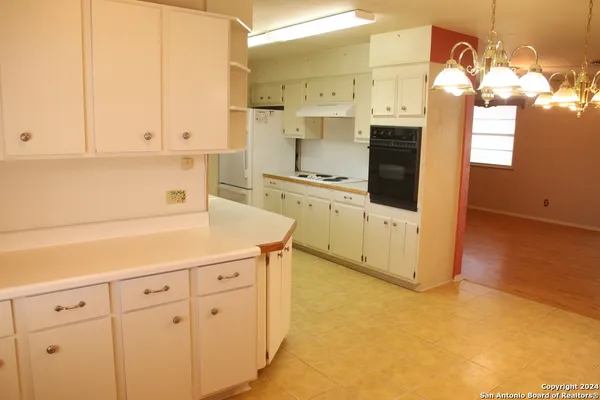 a view of a bathroom with a sink and a mirror