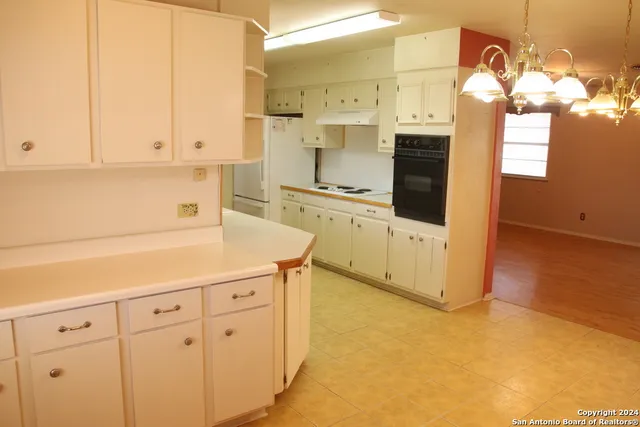 a view of a bathroom with a sink and a mirror
