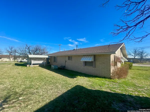 a view of a backyard of the house