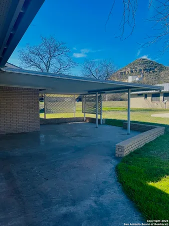 a view of an swimming pool with an outdoor space and seating area