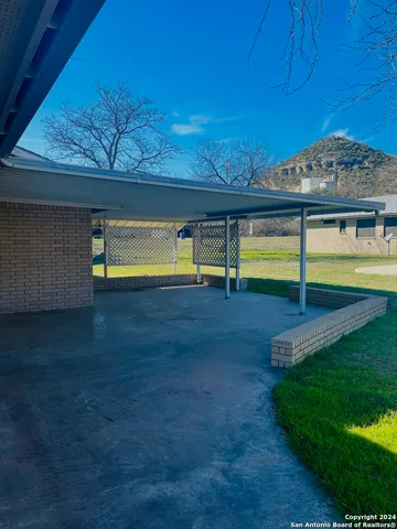 a view of an swimming pool with an outdoor space and seating area