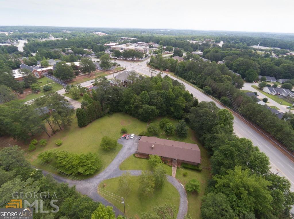 6190 Prestley Mill Road Douglasville, GA 30134 - Photo 2 of 12 an aerial view of residential houses with outdoor space and trees
