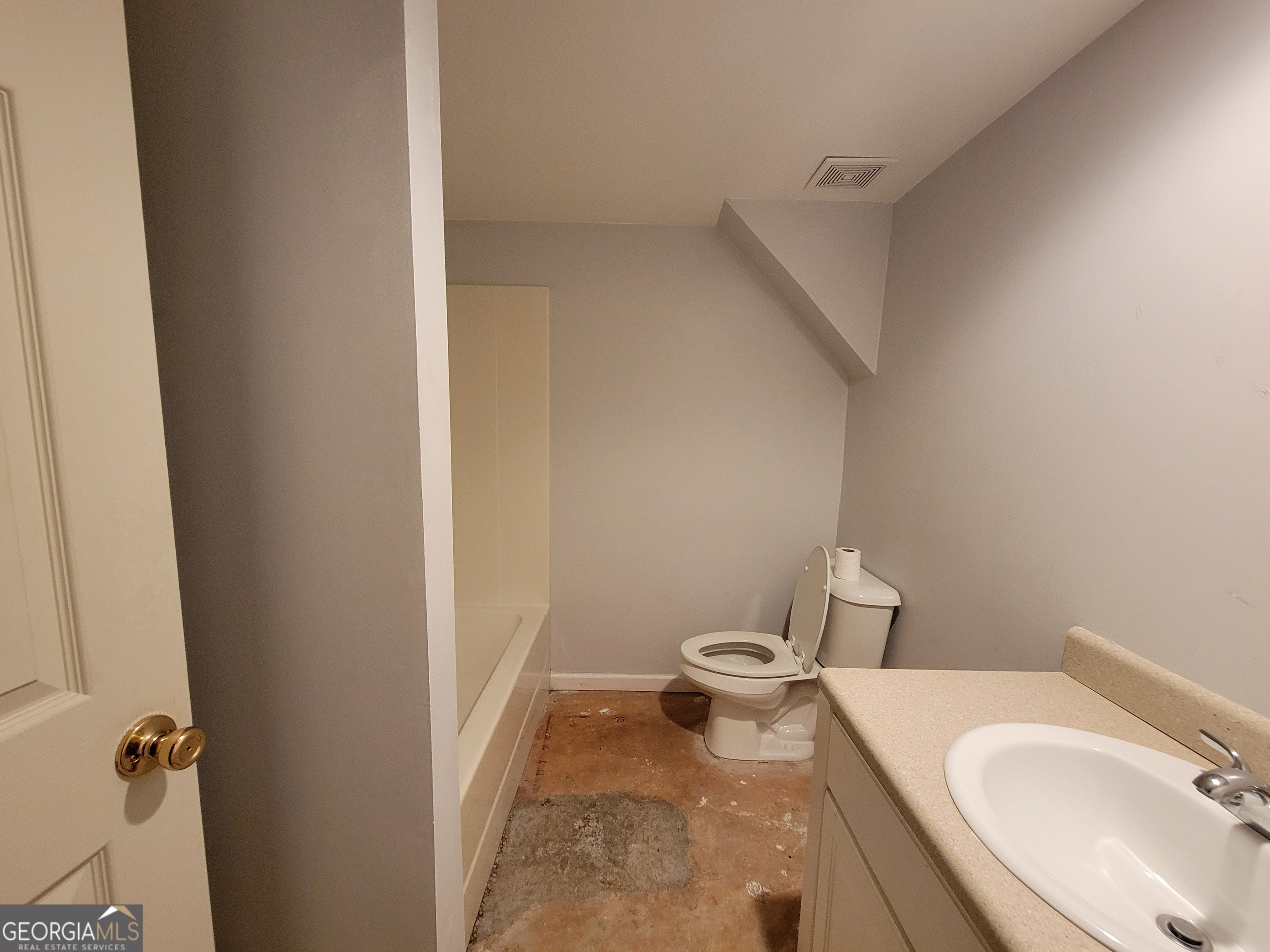 6190 Prestley Mill Road Douglasville, GA 30134 - Photo 6 of 12 a bathroom with a sink and toilet