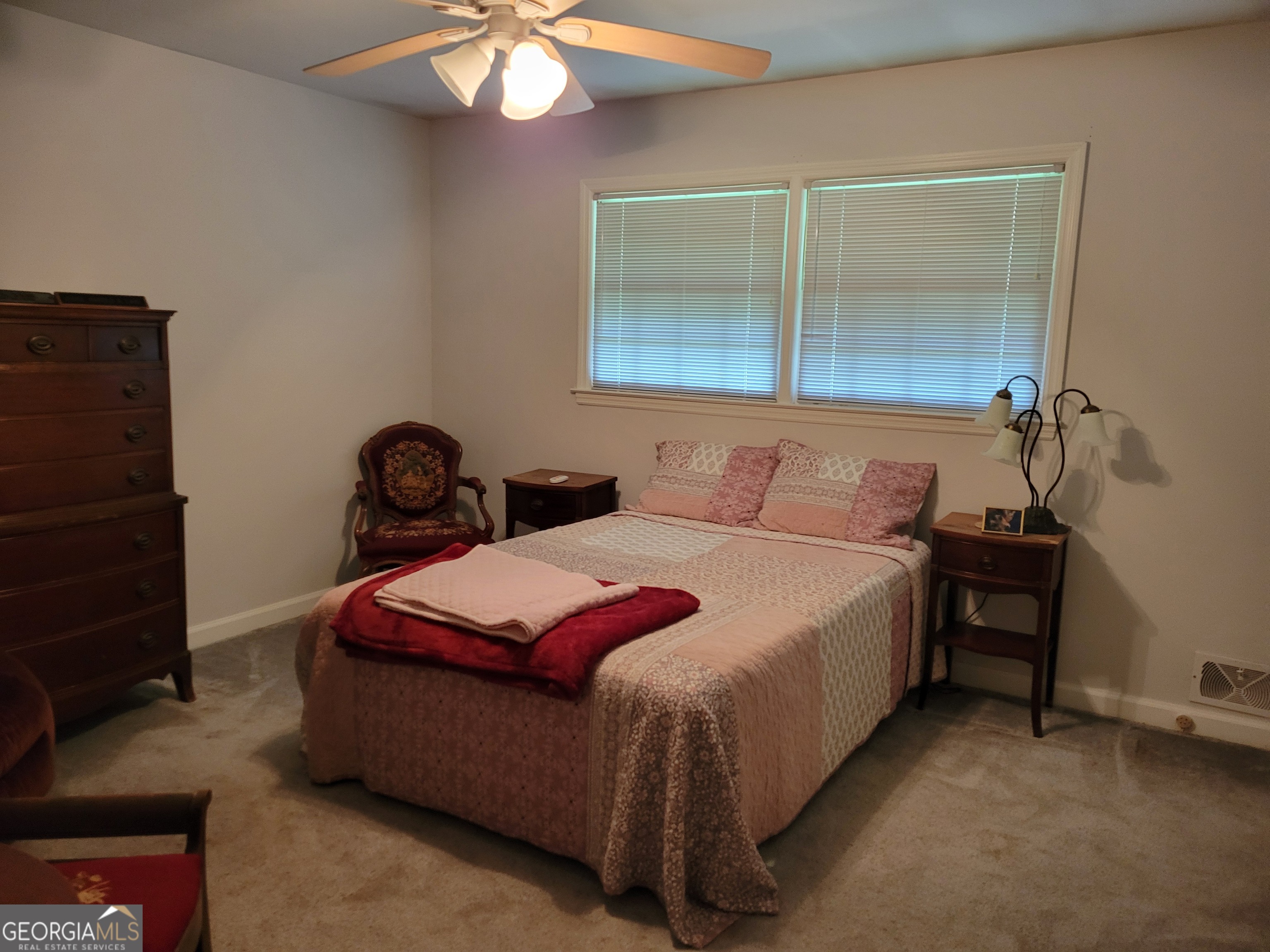 6190 Prestley Mill Road Douglasville, GA 30134 - Photo 9 of 12 a bedroom with a bed and a table