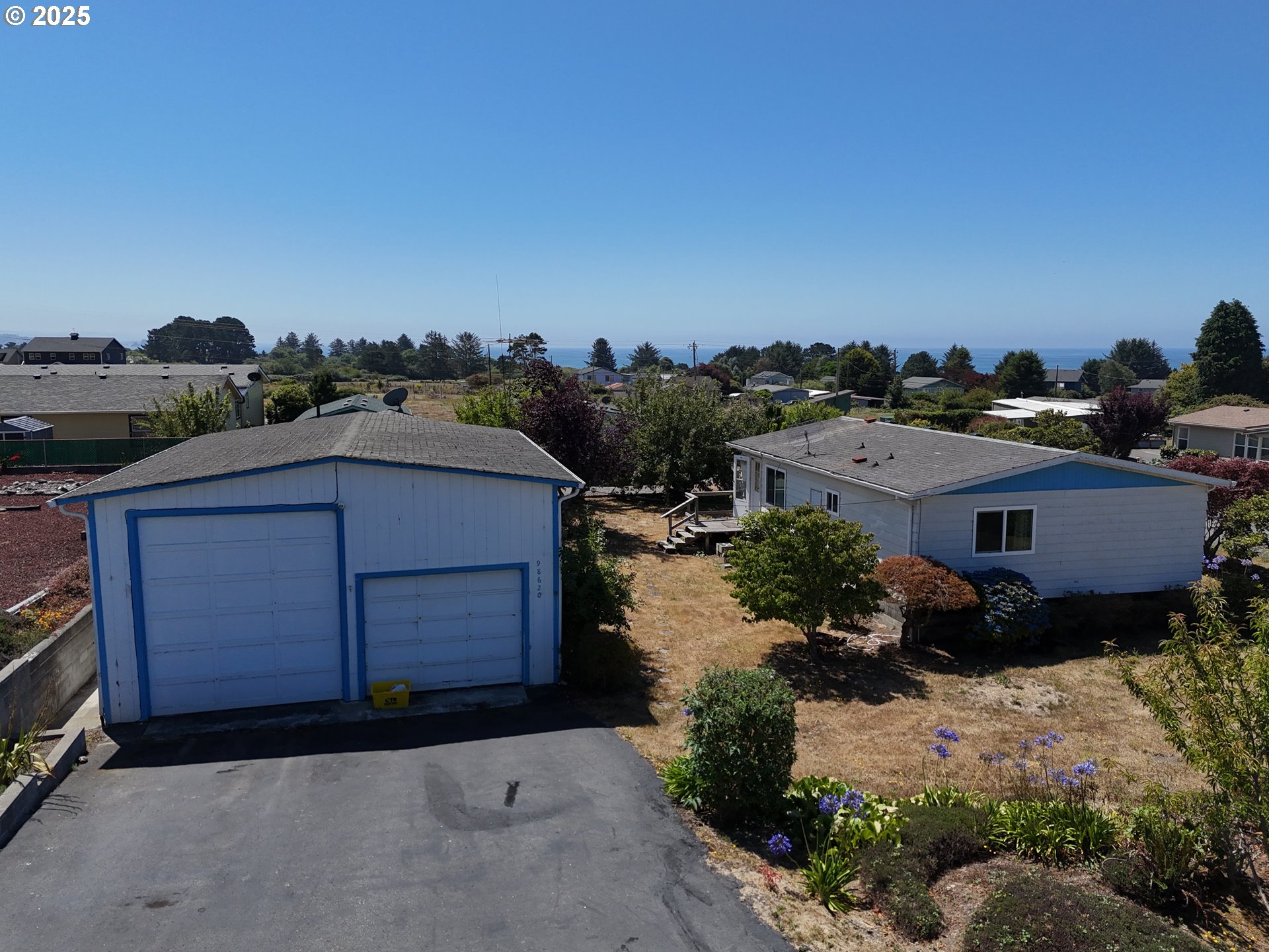 98620 Camellia Drive Brookings, OR 97415 - Photo 5 of 26 an aerial view of a house with a yard
