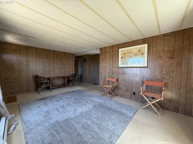 a kitchen with a table and chairs in it
