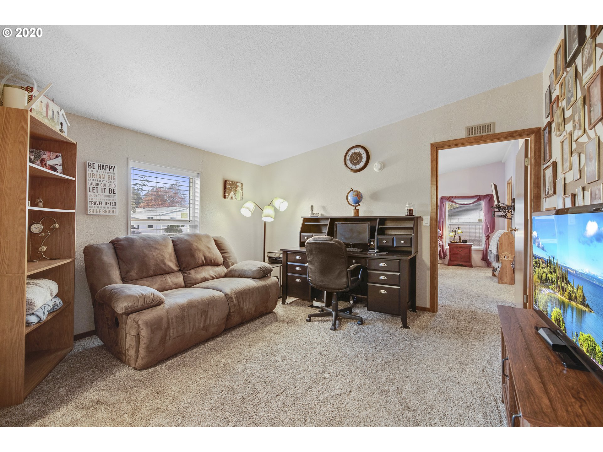 1500 South Sandoz Road, Unit 33 Newberg, OR 97132 - Photo 13 of 29 a living room with furniture and a flat screen tv