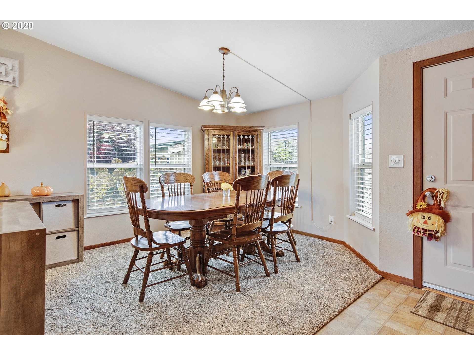 1500 South Sandoz Road, Unit 33 Newberg, OR 97132 - Photo 4 of 29 a view of a dining room with furniture and window