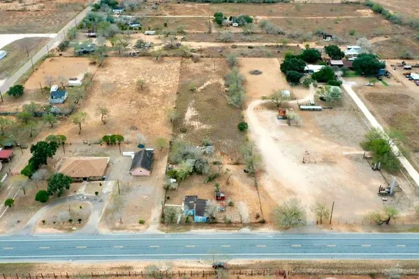 an aerial view of a houses with outdoor space