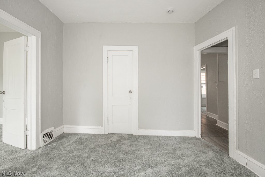 1000 Eddy Road Cleveland, OH 44108 - Photo 18 of 38 Unfurnished bedroom featuring carpet and baseboards