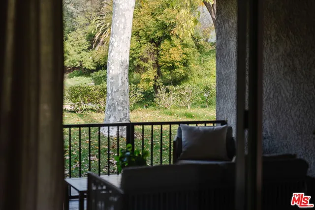 a view of a balcony with chair
