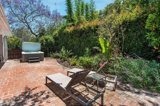 a view of a backyard with sitting area