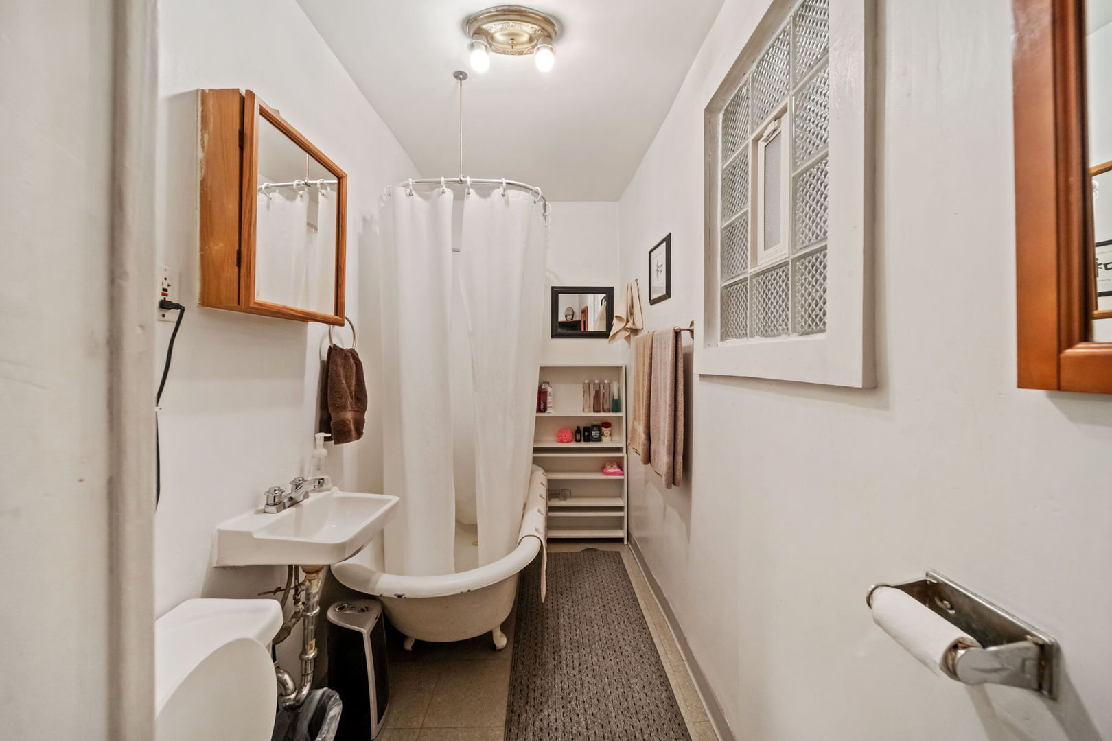 2236 West 19th Street Chicago, IL 60608 - Photo 16 of 40 a bathroom with a sink a toilet and a mirror