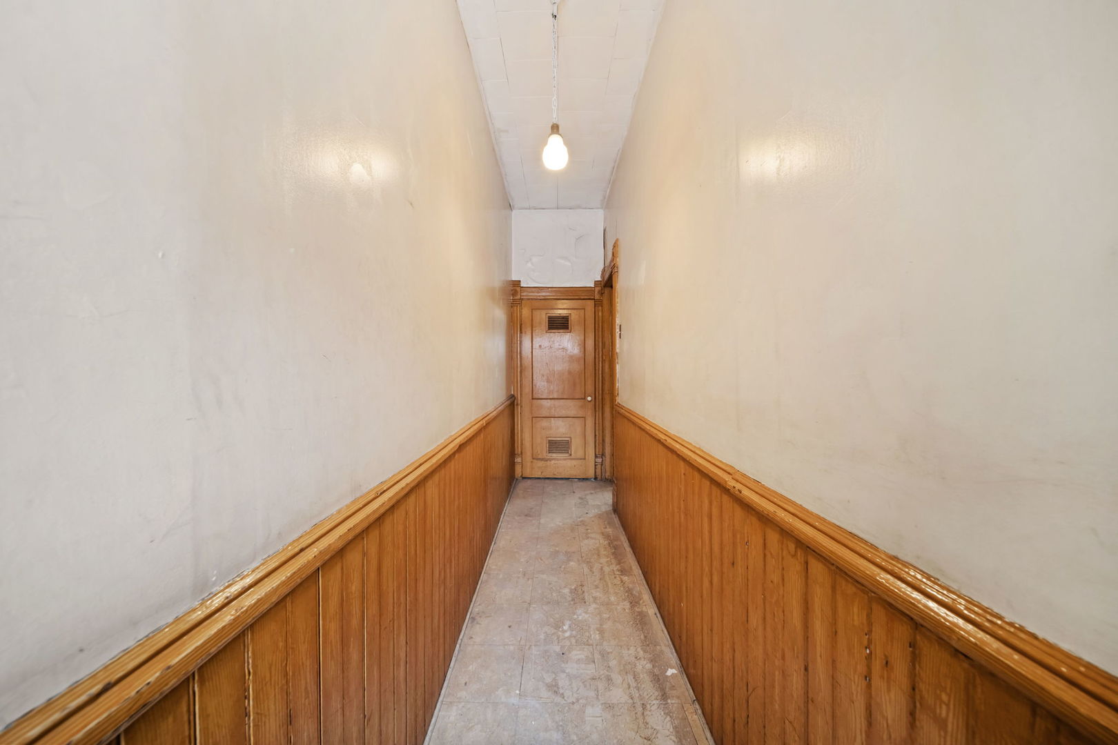 2236 West 19th Street Chicago, IL 60608 - Photo 2 of 40 a view of a hallway with wooden floor and staircase