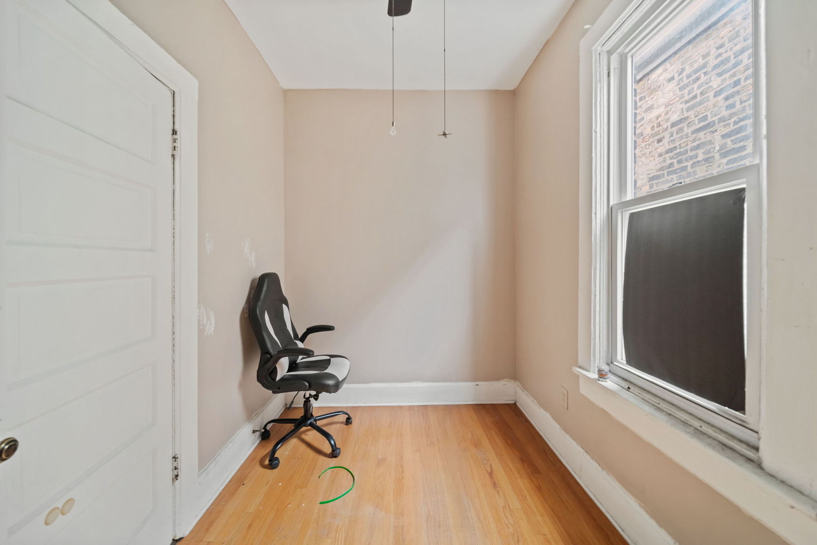 2236 West 19th Street Chicago, IL 60608 - Photo 26 of 40 a view of a workspace with furniture and a window