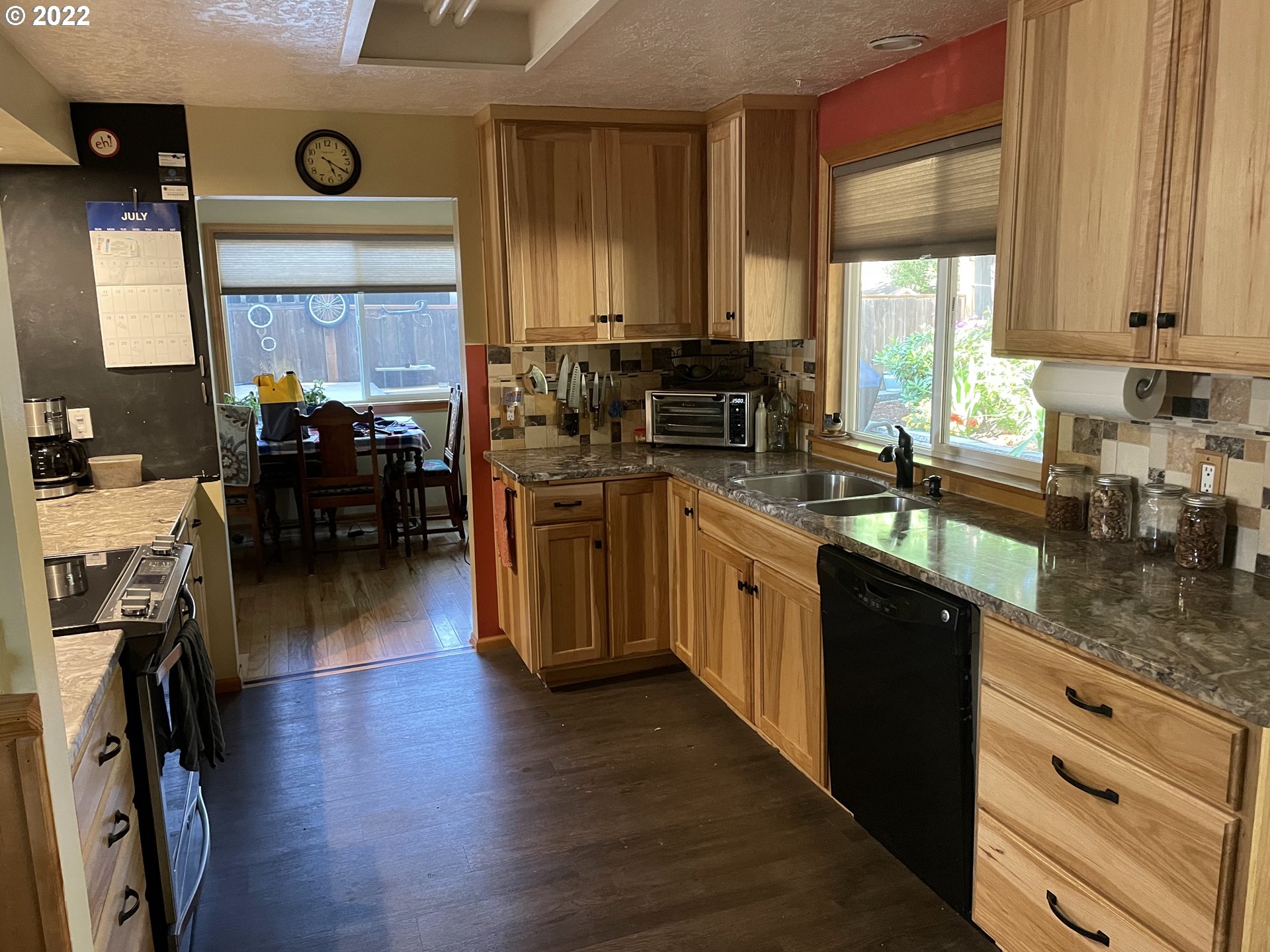 541 Hamilton Street Springfield, OR 97477 - Photo 12 of 15 a kitchen with stainless steel appliances granite countertop a stove a sink dishwasher and a refrigerator
