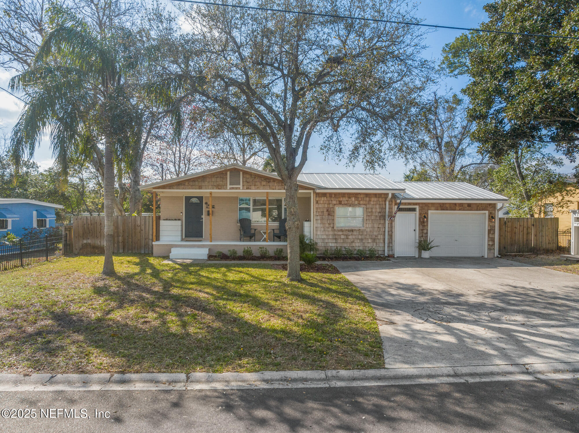 452 Sargo Road Atlantic Beach, FL 32233 - Photo 64 of 74 a house that has a tree in front of it