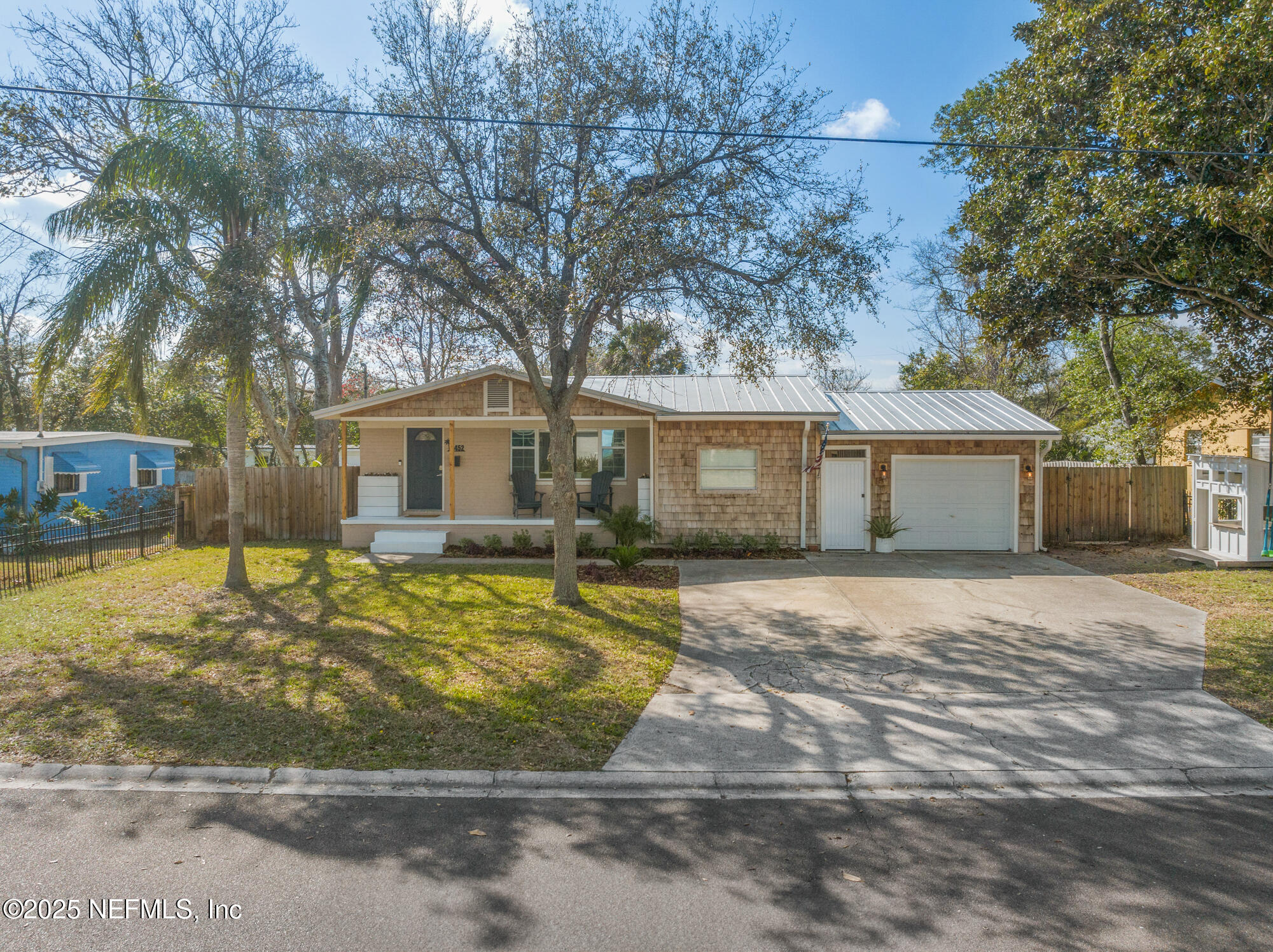 452 Sargo Road Atlantic Beach, FL 32233 - Photo 66 of 74 a house that has a tree in front of it